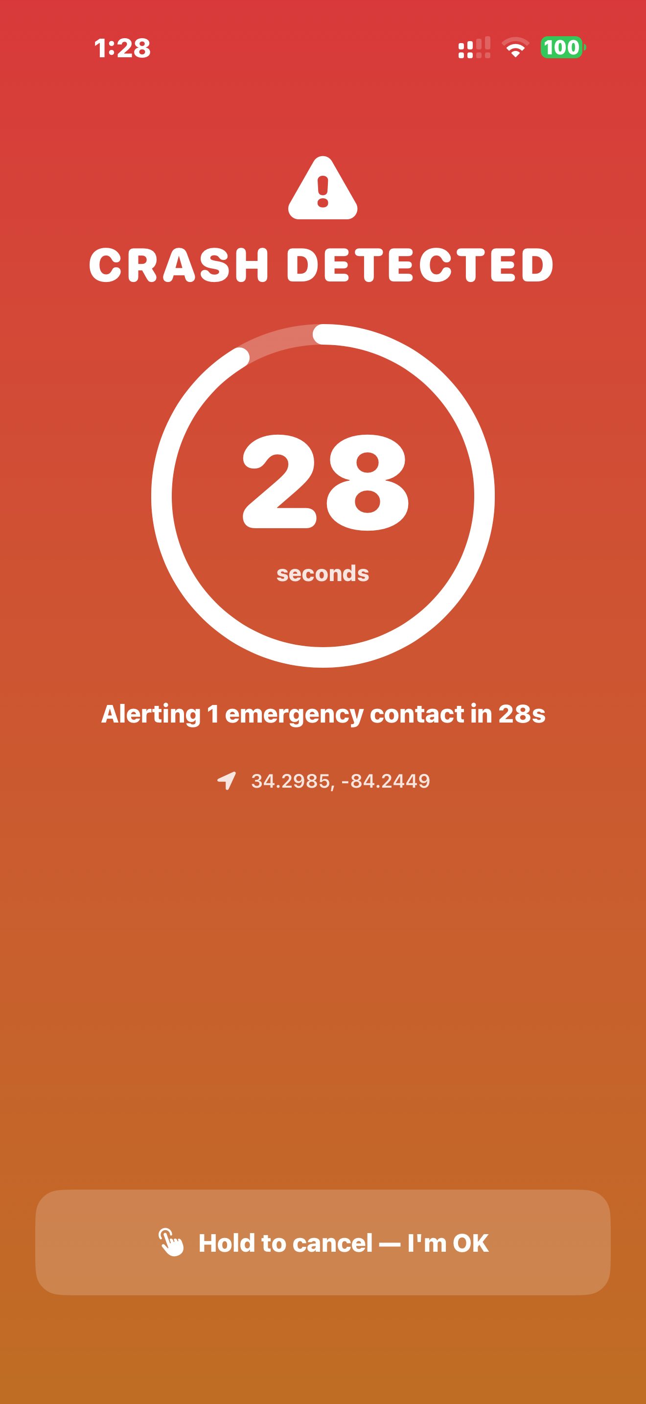 Crash Detected screen with a 28-second countdown, last-known coordinates, and a hold-to-cancel button